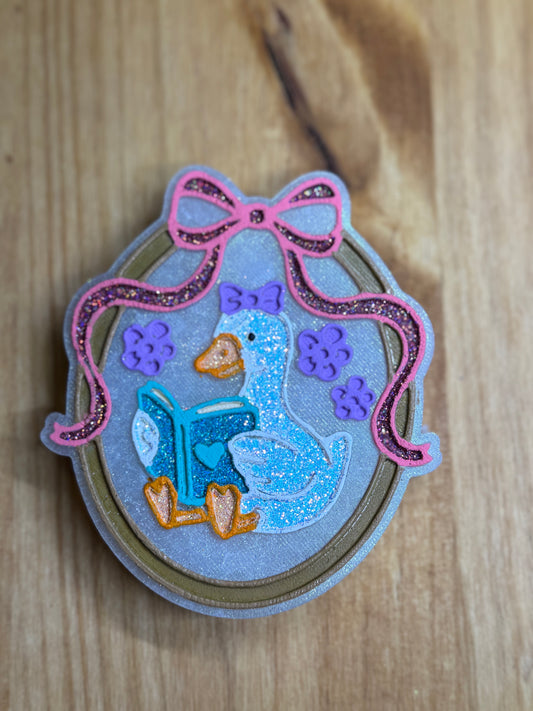 Goose in Frame with Book